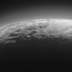 Imagen para el artículo titulado La NASA publica nuevas fotos de Plutón y sus espectaculares montañas de hielo